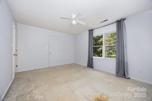 204 S Deerfield Cir, Salisbury, NC 28147 - unfurnished room featuring ceiling fan, carpet floors, and a textured ceiling