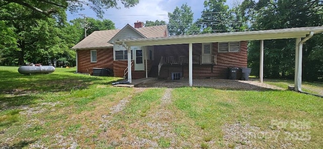 2828 Bellhaven Cir, Charlotte, NC 28214 - rear view of house featuring a yard and brick siding