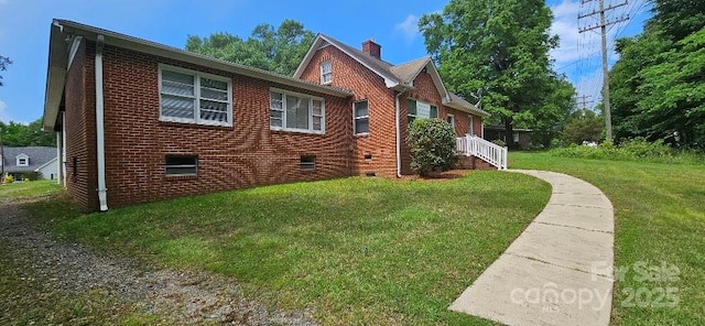 2828 Bellhaven Cir, Charlotte, NC 28214 - view of home's exterior featuring a yard, brick siding, and a chimney