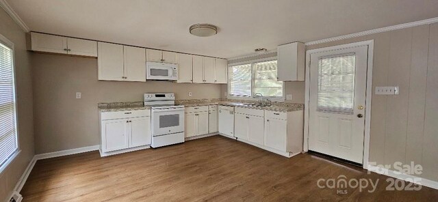 2828 Bellhaven Cir, Charlotte, NC 28214 - kitchen with white appliances, dark wood finished floors, white cabinets, and crown molding
