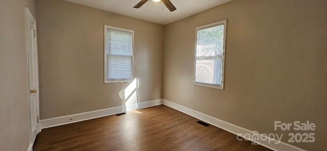 2828 Bellhaven Cir, Charlotte, NC 28214 - empty room featuring ceiling fan and dark wood finished floors
