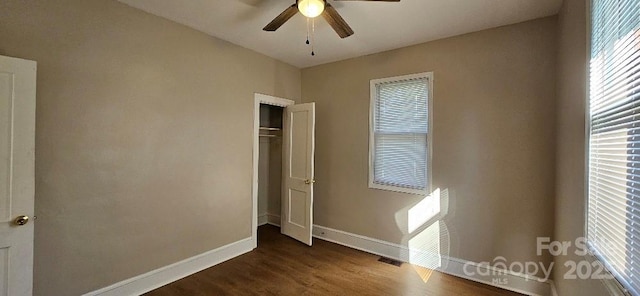 2828 Bellhaven Cir, Charlotte, NC 28214 - unfurnished bedroom with dark wood finished floors, a closet, and ceiling fan