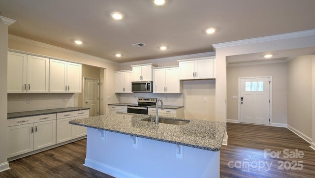 122 Sugg Trl, Weaverville, NC 28787 - kitchen with appliances with stainless steel finishes, dark wood-style flooring, tasteful backsplash, crown molding, and recessed lighting