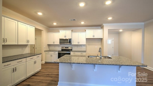 122 Sugg Trl, Weaverville, NC 28787 - kitchen with stainless steel appliances, ornamental molding, a breakfast bar area, backsplash, and dark wood-style floors