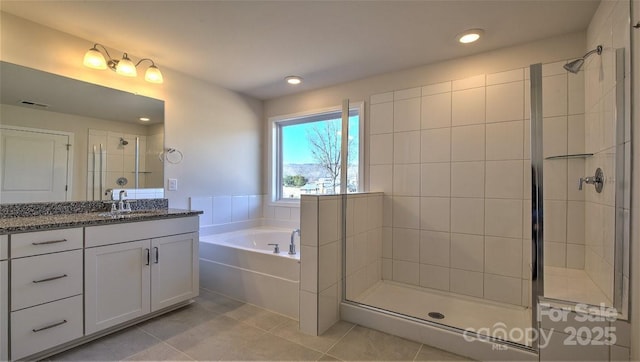 122 Sugg Trl, Weaverville, NC 28787 - bathroom featuring tile patterned floors, a garden tub, vanity, a stall shower, and recessed lighting