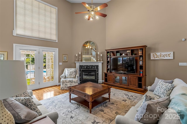 1236 James Farm Rd, Hickory, NC 28602 - living area with a high ceiling, wood finished floors, ceiling fan, and a premium fireplace