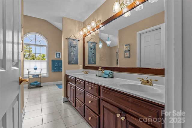1236 James Farm Rd, Hickory, NC 28602 - full bathroom featuring double vanity, vaulted ceiling, and tile patterned flooring
