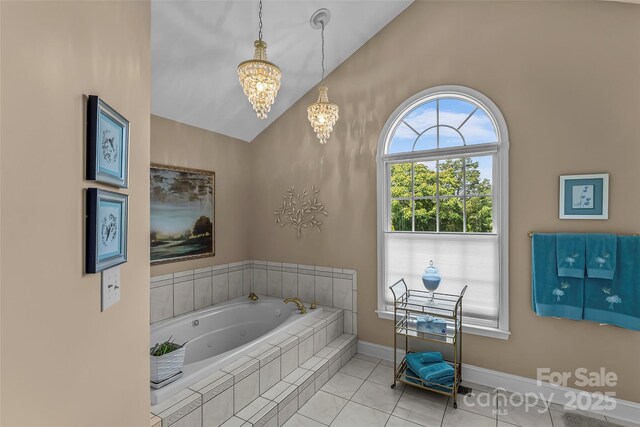 1236 James Farm Rd, Hickory, NC 28602 - full bath featuring lofted ceiling, a jetted tub, a chandelier, and tile patterned floors