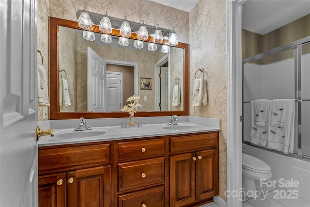 1236 James Farm Rd, Hickory, NC 28602 - bathroom with wallpapered walls, double vanity, shower / bath combination with glass door, and tile patterned flooring
