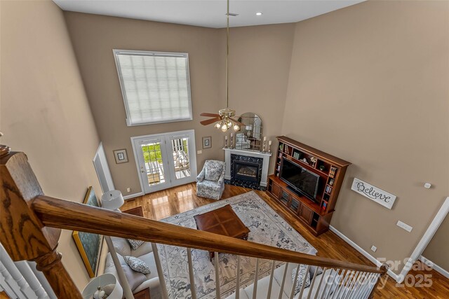 1236 James Farm Rd, Hickory, NC 28602 - living room with a high end fireplace, ceiling fan, wood finished floors, and a high ceiling