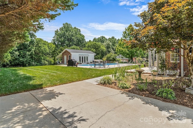 1236 James Farm Rd, Hickory, NC 28602 - swimming pool featuring area for grilling, a yard, a patio area, an outdoor structure, and an exterior structure