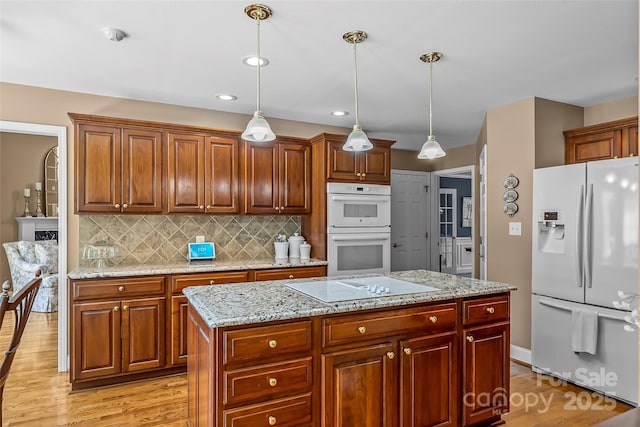 1236 James Farm Rd, Hickory, NC 28602 - kitchen with white appliances, light wood finished floors, decorative backsplash, decorative light fixtures, and recessed lighting