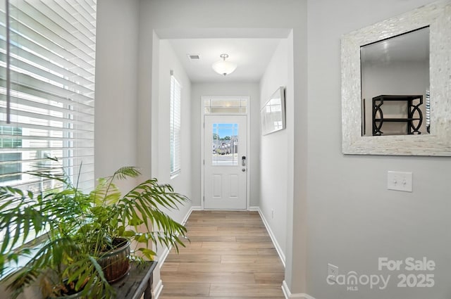 11246 Bartrams Way, Charlotte, NC 28278 - doorway featuring wood finished floors and baseboards