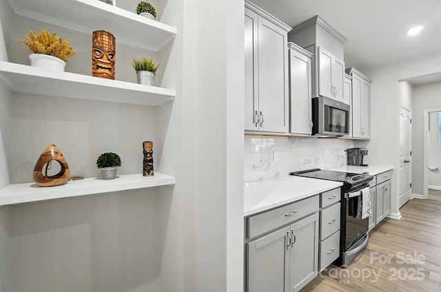 11246 Bartrams Way, Charlotte, NC 28278 - kitchen featuring appliances with stainless steel finishes, open shelves, decorative backsplash, light wood-style floors, and recessed lighting