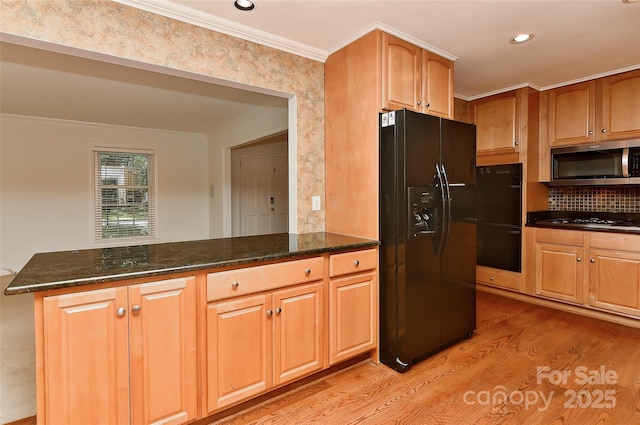 6117 Yellowood Rd, Charlotte, NC 28210 - kitchen featuring black appliances, light wood-style flooring, dark stone countertops, a peninsula, and decorative backsplash