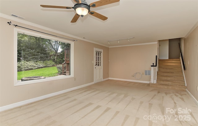 6117 Yellowood Rd, Charlotte, NC 28210 - unfurnished living room featuring rail lighting, stairs, carpet, ornamental molding, and ceiling fan