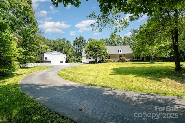 6811 Kluttz Rd, Concord, NC 28025 - view of front facade with a garage, an outdoor structure, a front lawn, and driveway