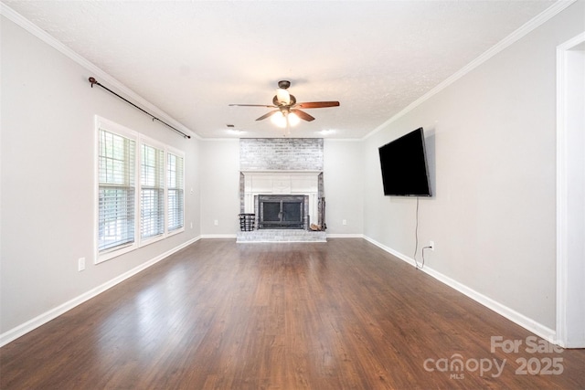 6811 Kluttz Rd, Concord, NC 28025 - unfurnished living room featuring ceiling fan, dark wood-type flooring, a brick fireplace, and ornamental molding