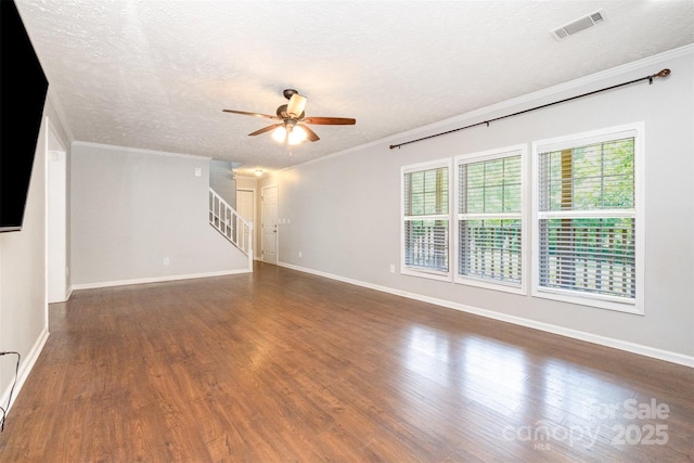 6811 Kluttz Rd, Concord, NC 28025 - unfurnished living room with ceiling fan, crown molding, stairway, wood finished floors, and a textured ceiling