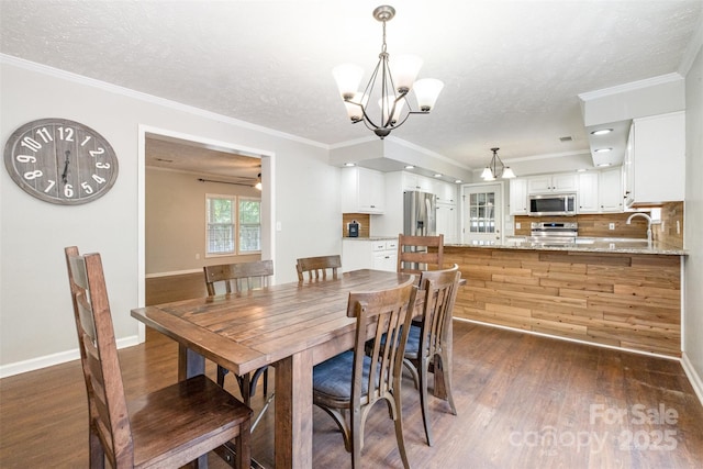 6811 Kluttz Rd, Concord, NC 28025 - dining area with dark wood finished floors, a chandelier, crown molding, and a textured ceiling