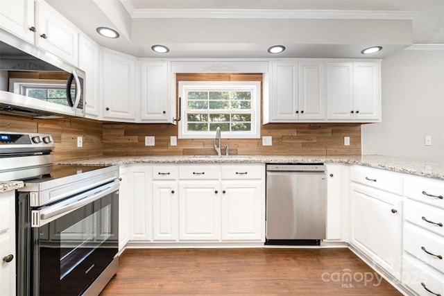 6811 Kluttz Rd, Concord, NC 28025 - kitchen featuring stainless steel appliances, crown molding, white cabinetry, dark wood finished floors, and light stone countertops