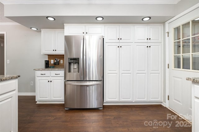 6811 Kluttz Rd, Concord, NC 28025 - kitchen with stainless steel refrigerator with ice dispenser, crown molding, dark wood finished floors, light stone countertops, and white cabinetry