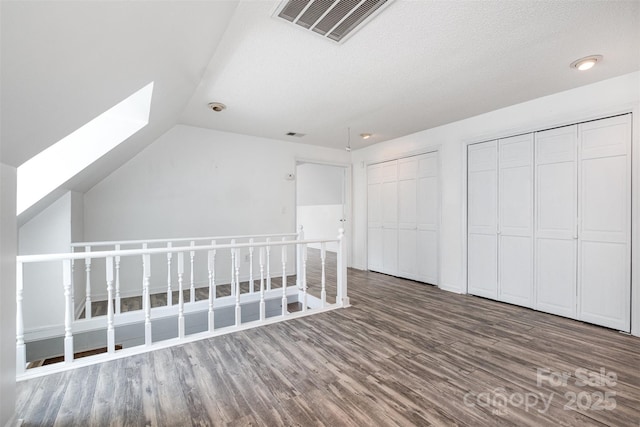 6811 Kluttz Rd, Concord, NC 28025 - bonus room with wood finished floors, a skylight, and lofted ceiling