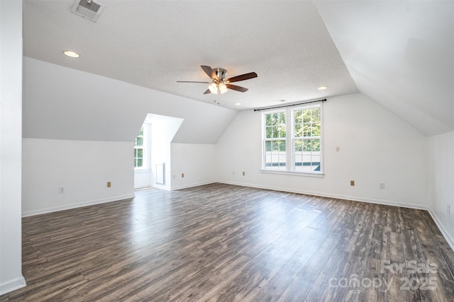 6811 Kluttz Rd, Concord, NC 28025 - additional living space featuring dark wood-type flooring, plenty of natural light, lofted ceiling, ceiling fan, and recessed lighting
