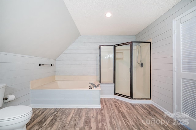 6811 Kluttz Rd, Concord, NC 28025 - bathroom featuring a garden tub, wood finished floors, a shower stall, wooden walls, and vaulted ceiling