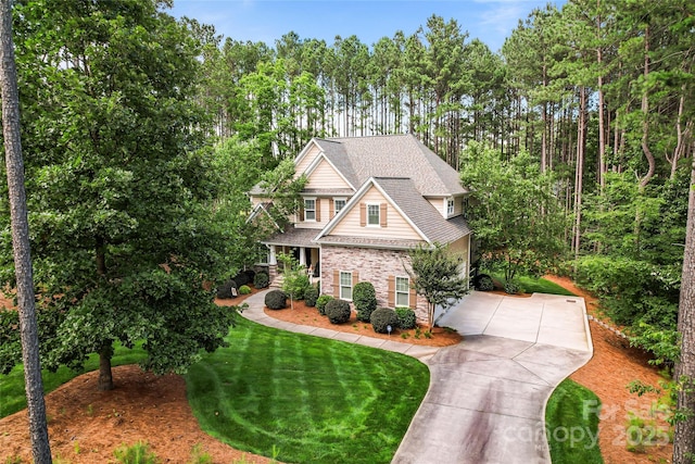 109 Trent Pines Dr, Mooresville, NC 28117 - craftsman-style home with driveway, a front lawn, stone siding, and roof with shingles