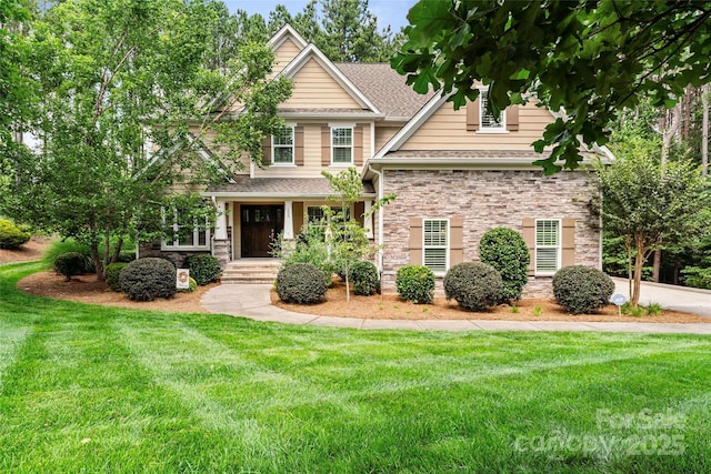 109 Trent Pines Dr, Mooresville, NC 28117 - craftsman inspired home with a front lawn, a shingled roof, and stone siding