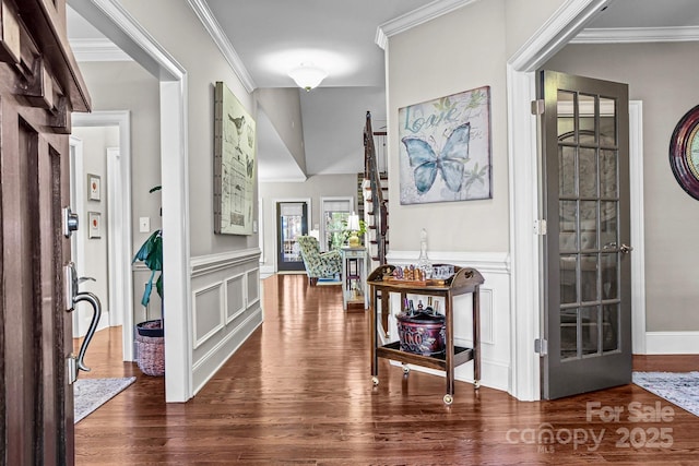 109 Trent Pines Dr, Mooresville, NC 28117 - entryway with dark wood-style floors, crown molding, a wainscoted wall, and a decorative wall