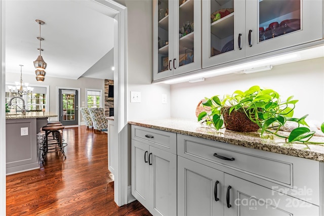 109 Trent Pines Dr, Mooresville, NC 28117 - bar area with dark wood-type flooring, pendant lighting, a chandelier, and vaulted ceiling