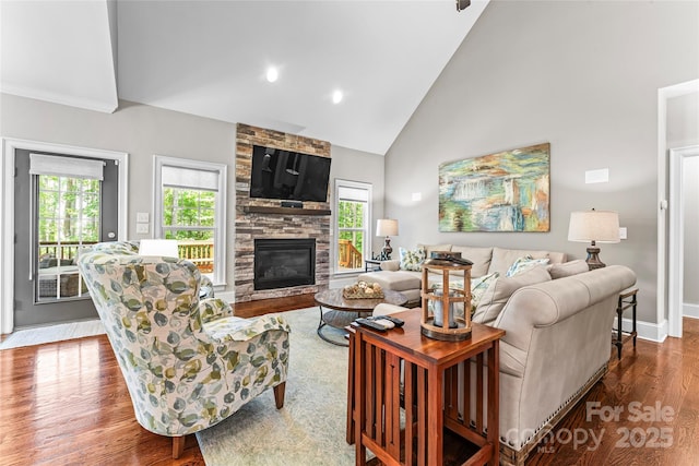109 Trent Pines Dr, Mooresville, NC 28117 - living room featuring plenty of natural light, dark wood finished floors, high vaulted ceiling, a fireplace, and recessed lighting