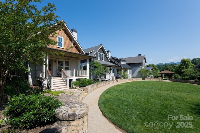 12 Fay Jones Ln, Black Mountain, NC 28711 - view of front of home with a porch, a front yard, a chimney, and stairway