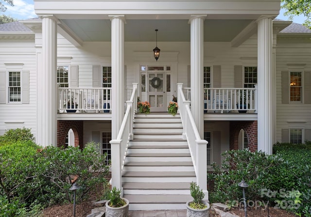 2324 Kingsmill Ter, Charlotte, NC 28270 - entrance to property with a porch and brick siding
