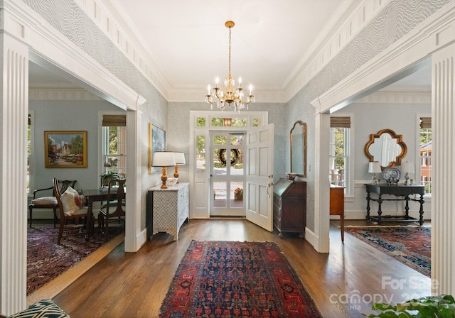 2324 Kingsmill Ter, Charlotte, NC 28270 - entryway with wood finished floors, healthy amount of natural light, a chandelier, wallpapered walls, and ornamental molding