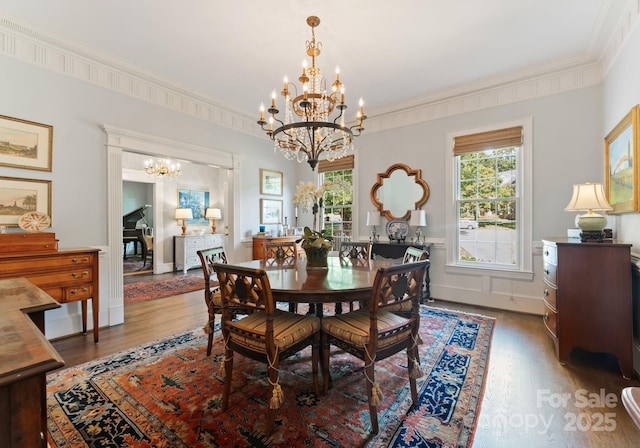 2324 Kingsmill Ter, Charlotte, NC 28270 - dining space featuring a chandelier, wood finished floors, plenty of natural light, and ornamental molding