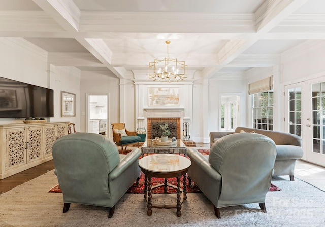 2324 Kingsmill Ter, Charlotte, NC 28270 - living area with coffered ceiling, a chandelier, crown molding, beam ceiling, and a brick fireplace
