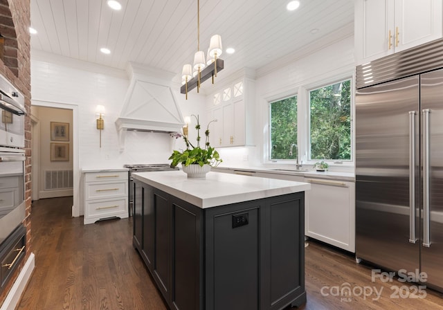 2324 Kingsmill Ter, Charlotte, NC 28270 - kitchen featuring built in refrigerator, recessed lighting, white cabinetry, light countertops, and custom exhaust hood