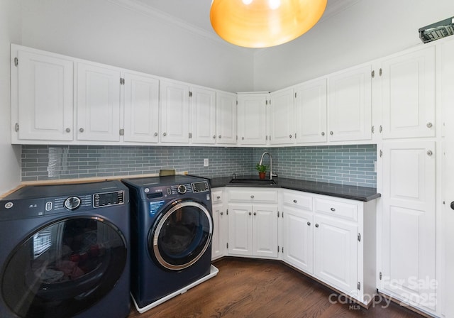 2324 Kingsmill Ter, Charlotte, NC 28270 - laundry room with cabinet space, washer and clothes dryer, crown molding, and dark wood-style floors