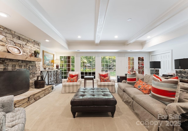 2324 Kingsmill Ter, Charlotte, NC 28270 - carpeted living room featuring crown molding, a raised ceiling, a stone fireplace, and recessed lighting
