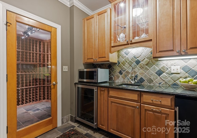 2324 Kingsmill Ter, Charlotte, NC 28270 - kitchen featuring beverage cooler, stainless steel microwave, crown molding, decorative backsplash, and dark stone counters