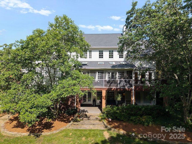 2324 Kingsmill Ter, Charlotte, NC 28270 - view of front of home featuring french doors, a shingled roof, and a wooden deck