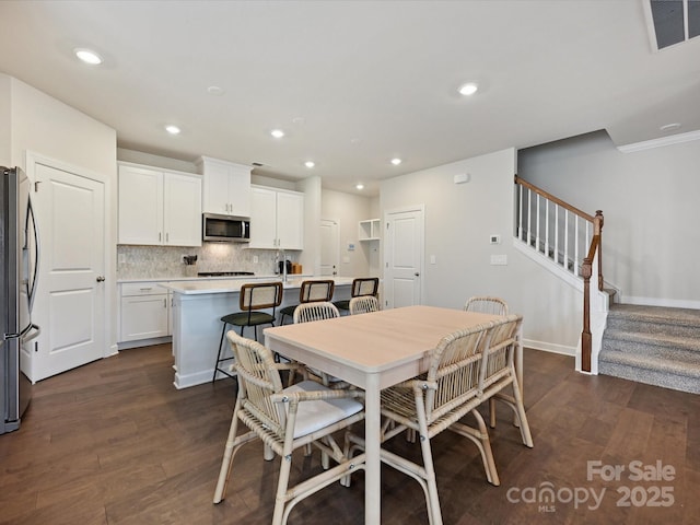 835 Windage Way, Pineville, NC 28134 - dining space with dark wood-style flooring, stairs, and recessed lighting