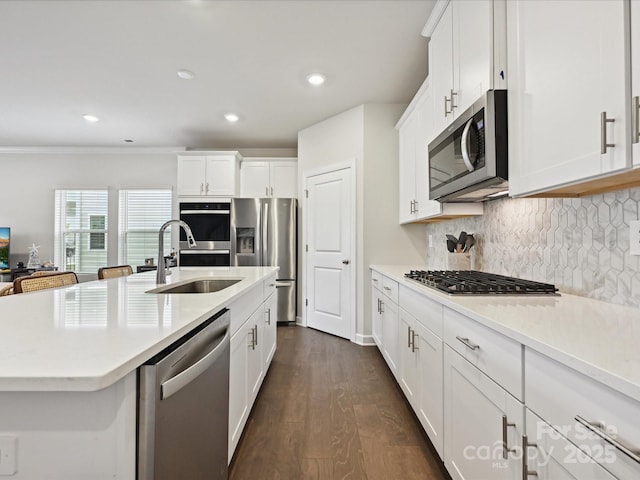 835 Windage Way, Pineville, NC 28134 - kitchen with stainless steel appliances, light countertops, decorative backsplash, white cabinetry, and crown molding