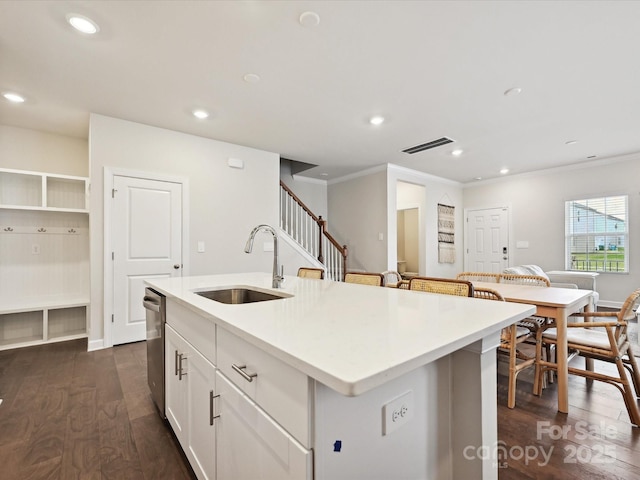 835 Windage Way, Pineville, NC 28134 - kitchen with ornamental molding, a center island with sink, white cabinetry, light countertops, and dark wood finished floors