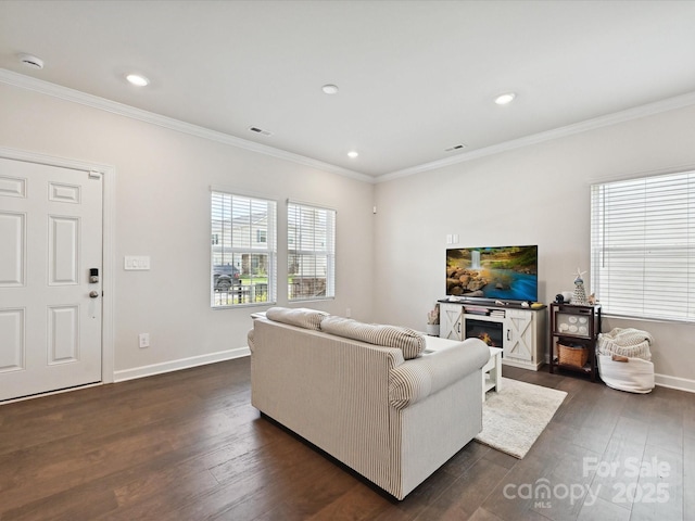 835 Windage Way, Pineville, NC 28134 - living area featuring ornamental molding, dark wood-type flooring, a glass covered fireplace, and recessed lighting