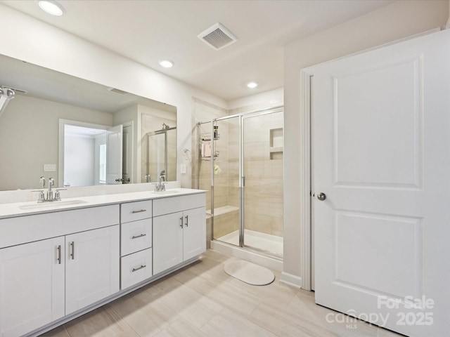 835 Windage Way, Pineville, NC 28134 - bathroom with a stall shower, double vanity, and recessed lighting