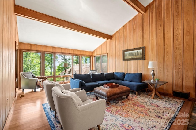 2045 Hogback Mountain Rd, Tryon, NC 28782 - living room with wood walls, plenty of natural light, and light wood finished floors